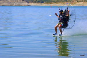 Vicente Palmero Flies just over the water pushed by his paramotor